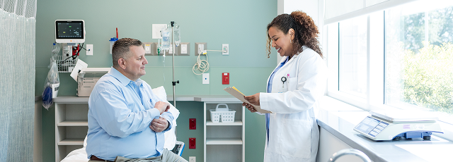 Doctor consulting  patient about clinical trials and clinical studies for  obesity and weight-related health conditions