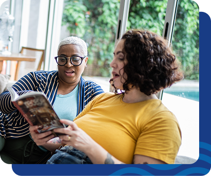 Friends reading together, discussing personal experience living with overweight or obesity and related conditions